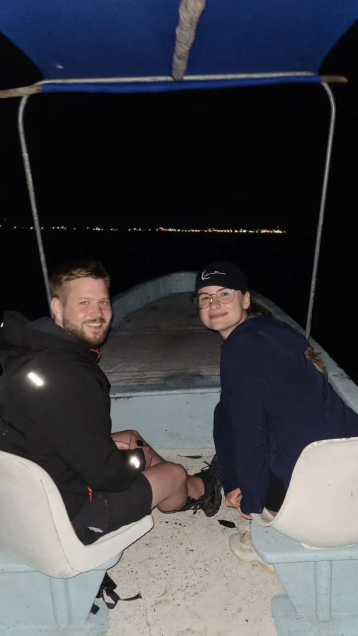 Couple in the boat during the night tour
